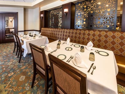 Elegant dining room setup with tables and chairs