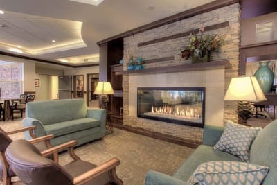 Cozy common area with a fireplace and seating