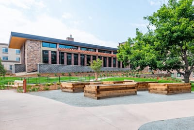 Exterior view of Frasier Retirement Community with outdoor space