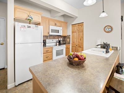 Modern kitchen setup with fruits in a bowl