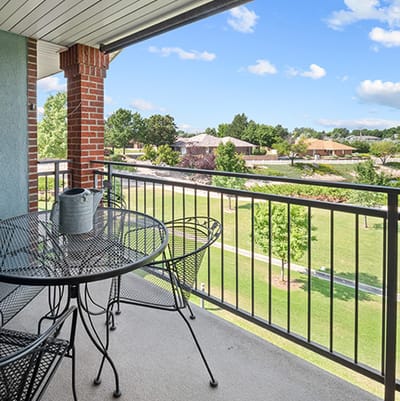 Balcony view overlooking green outdoor space
