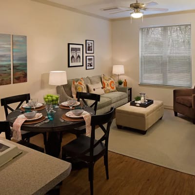 Cozy interior of a resident suite with a living area and dining table