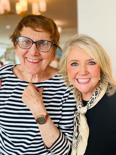 Two smiling women posing for a photo.