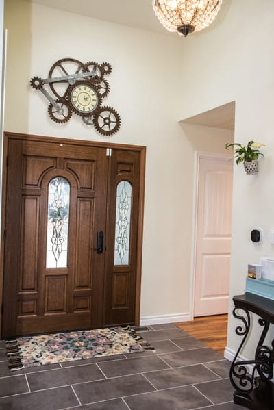 Entrance hallway with decorative clock and front door