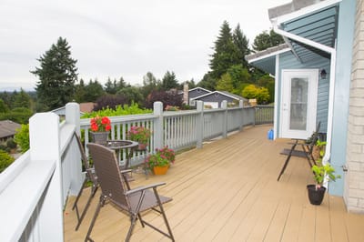 Outdoor deck with seating and decorative flowers