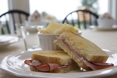 Close-up of a ham sandwich on a plate
