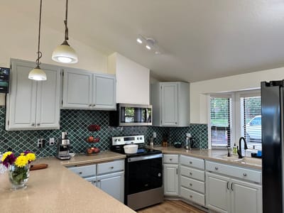 Bright kitchen area with modern appliances and decor