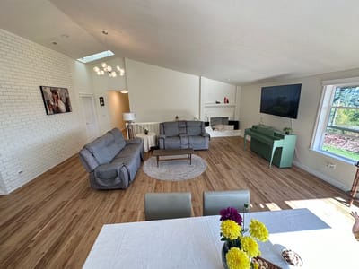Bright common area with comfortable seating and decor