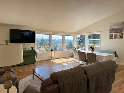 Bright and airy common area with large windows and seating
