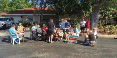 Residents socializing outdoors in a casual setting