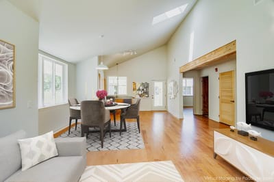 Bright interior space with dining area and seating