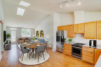 Bright interior common area with dining set and living space
