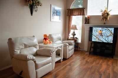 Cozy interior with chairs and TV in common area