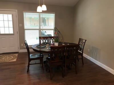 Simple dining area with a wooden table and chairs