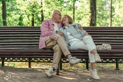 Couple sitting on a bench in a park