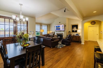 Bright common area with seating and a dining table
