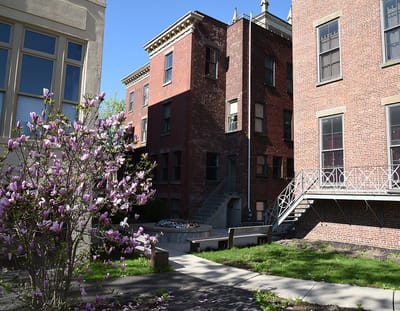 Exterior view of the facility with blooming flowers