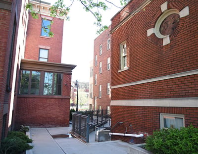 Outdoor view of a brick building with walkway
