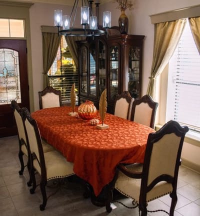 Decorative dining room with an elegantly set table