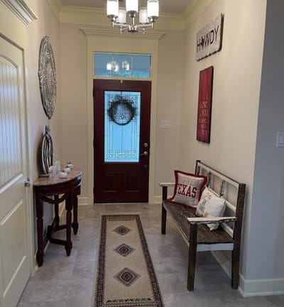 Welcoming entrance hallway with decor and bench