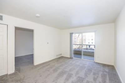 Bright, empty room with a view of the balcony