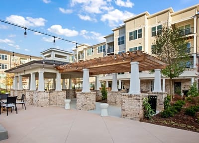Outdoor patio area with seating and building backdrop