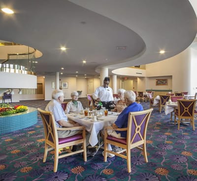 Residents enjoying a meal in the dining room