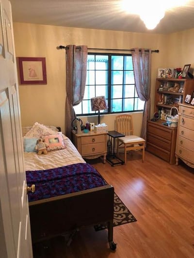 Private resident room with bed and furniture