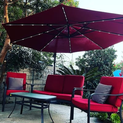 Outdoor seating area with a shade umbrella