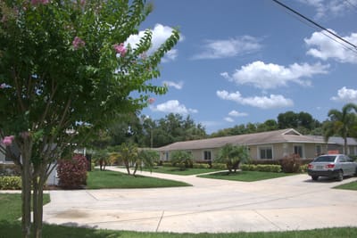 Outdoor view of Kare Assisted Living facility with gardens