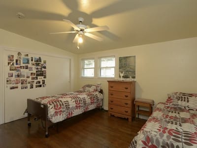 Shared resident room with two beds and personal decorations