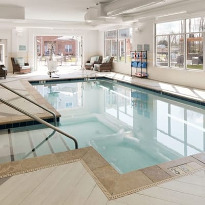 Indoor pool area with comfortable seating