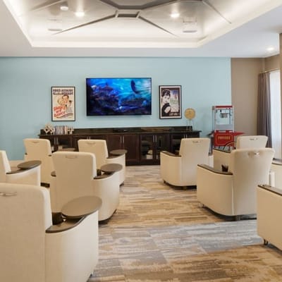 Common area with seating and a large TV