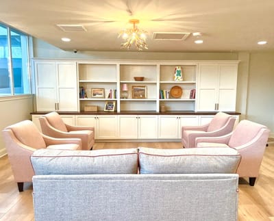 Cozy common area with seating and bookshelves