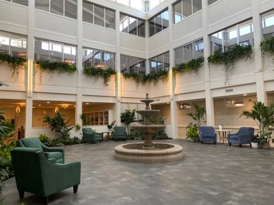 Interior lobby featuring a fountain and seating area
