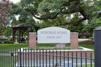 Exterior view of Poydras Home sign and entrance