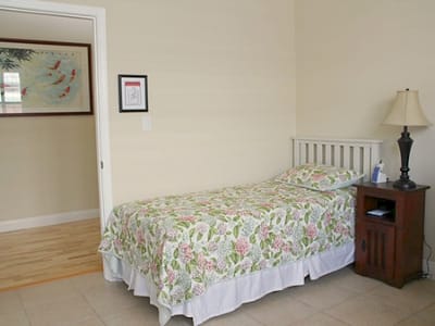 Private resident room with a bed and nightstand