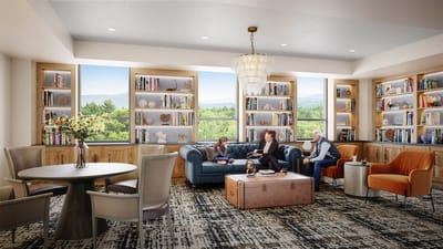 Residents enjoying a cozy common area with bookshelves