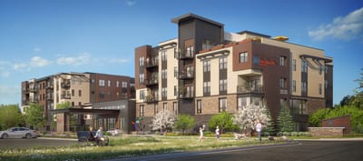 Exterior view of a modern assisted living facility with residents