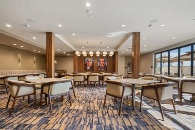 Dining room with modern tables and artwork