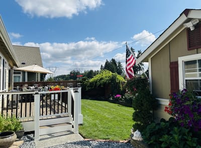 Well-maintained garden area with American flag