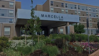 Exterior view of Marcella Manor Apartments with landscaping