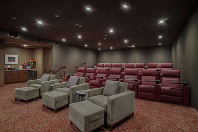 Cozy interior of a movie theater with reclining seats