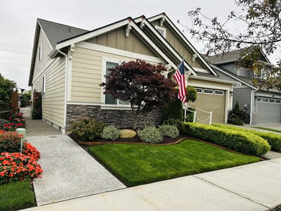 Exterior view of a residential care facility with landscaped yard
