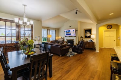 Bright common area with seating and dining table