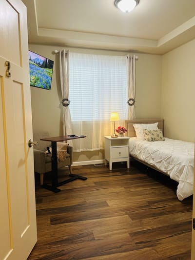 Cozy private resident room with a bed and decor
