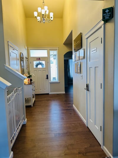 Bright hallway with doors and lighting fixtures