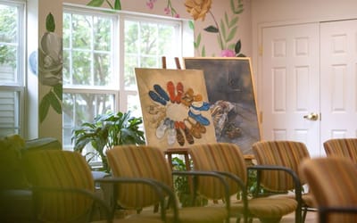 Artwork displayed in a common area with seating