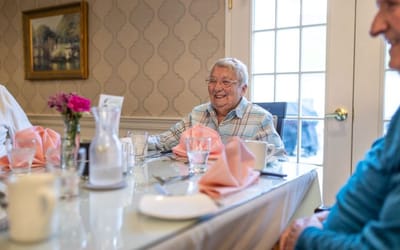 Residents enjoying a meal in a dining room