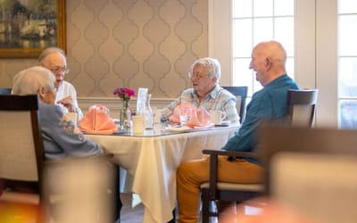 Residents enjoying a meal together in a dining area